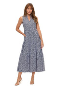 Woman wearing a sleeveless floral dress on a white background