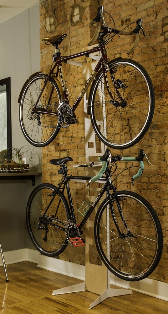 Saris Hottie 2-Bike Storage Stand — walnut-and-steel frame holding road bike upright