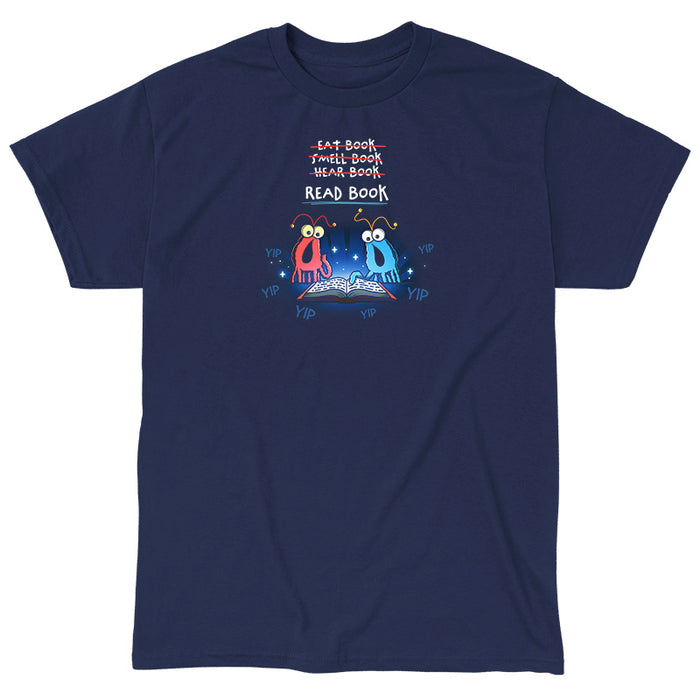 Classic Cotton T-shirt_TeeTurtle navy The Martians Read Book Classic Cotton T-shirt featuring the red and blue yip yip martians from Sesame Street in a classic moment where they are trying to figure out what to do with a book that is open in front of them. Text above them reads "Eat Book," "Smell Book," and "Hear Book" with all of them crossed out and "Read Book" underneath. They are surrounded by the word "yip."