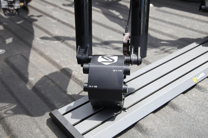 Saris Traps fork-mount carriers in truck bed — bikes locked in for road trip