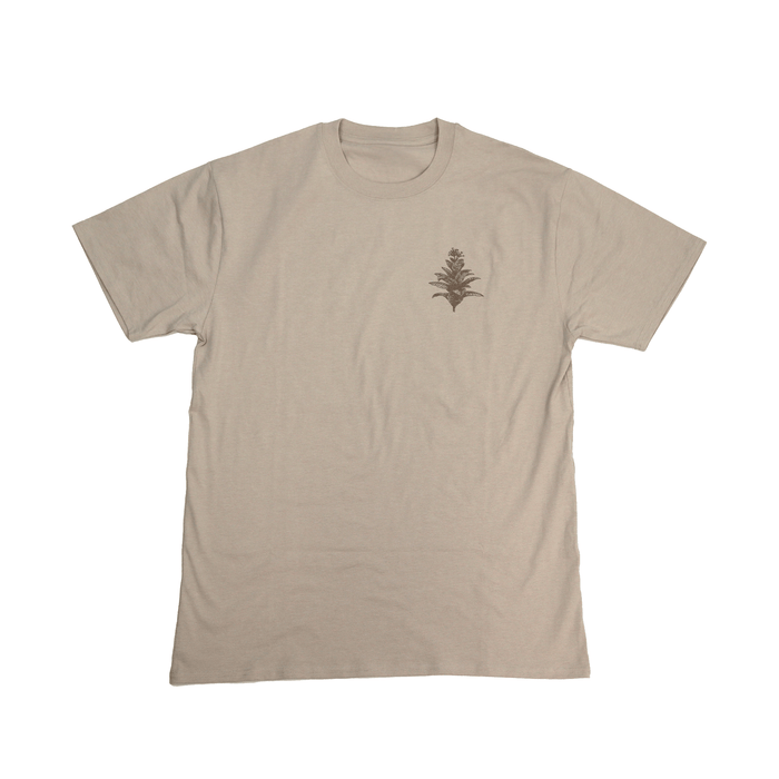 Flat lay front view of Tobacco Medicine Tee in beige with Indigenous design