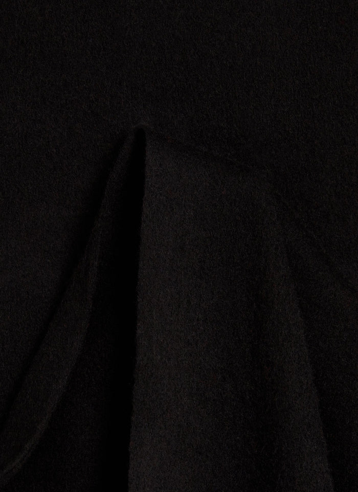 A close-up of the soft, black 100% wool fabric of the Tolkein Scarf from Percival.