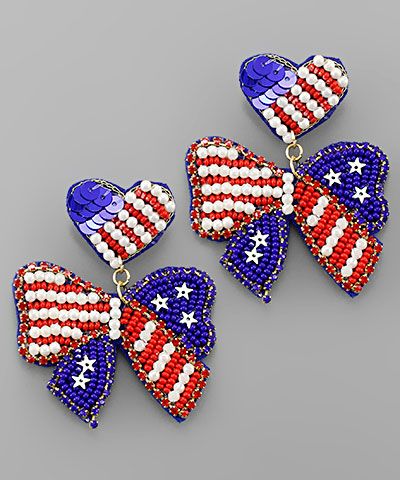 Red, white, and blue US flag ribbon bead earrings with crystal and pearl accents displayed on a neutral background from The Pink Doxie Boutique.