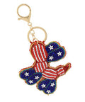 Patriotic USA dog keychain with red, white, and blue seed bead detailing, photographed for The Pink Doxie Boutique.