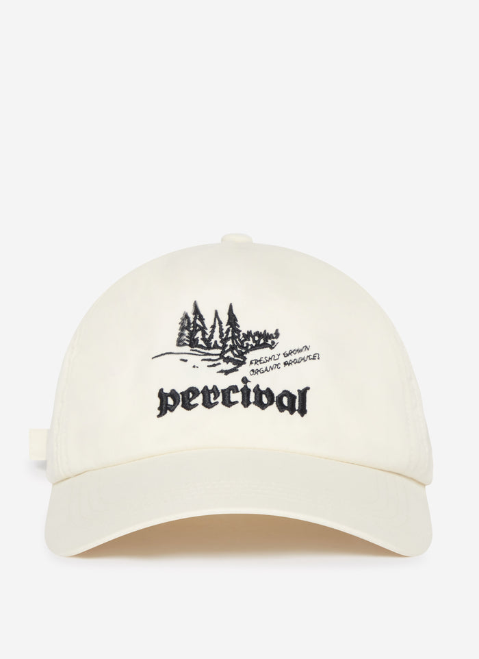 A studio shot of the ecru Wildlands Soft Trucker Cap by Percival, featuring the black embroidered forest graphic.